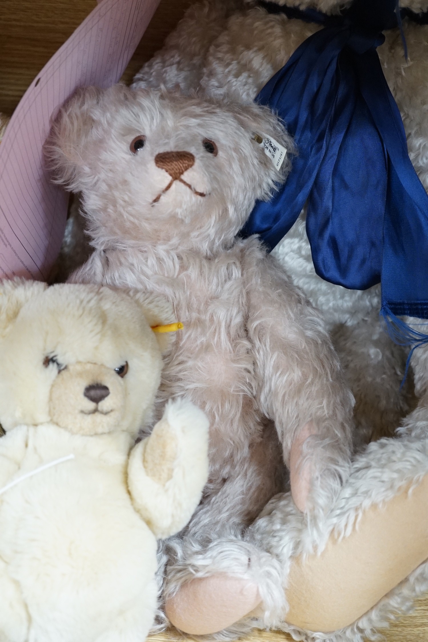 A large Steiff growler blonde plush teddy bear, 68cms long and four other Steiff teddy bears